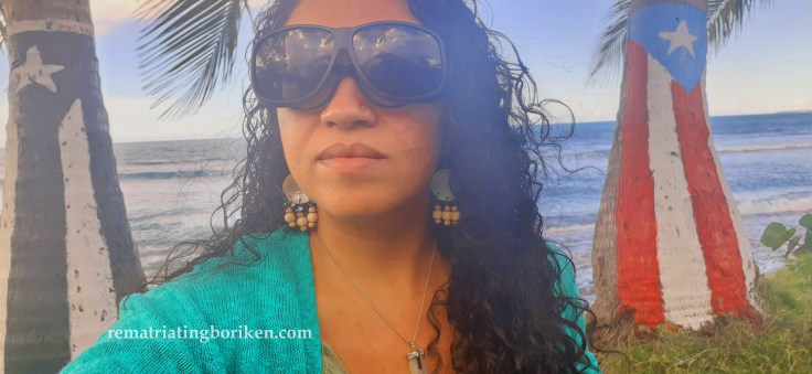 Yasmin with Puerto Rican flags and sea